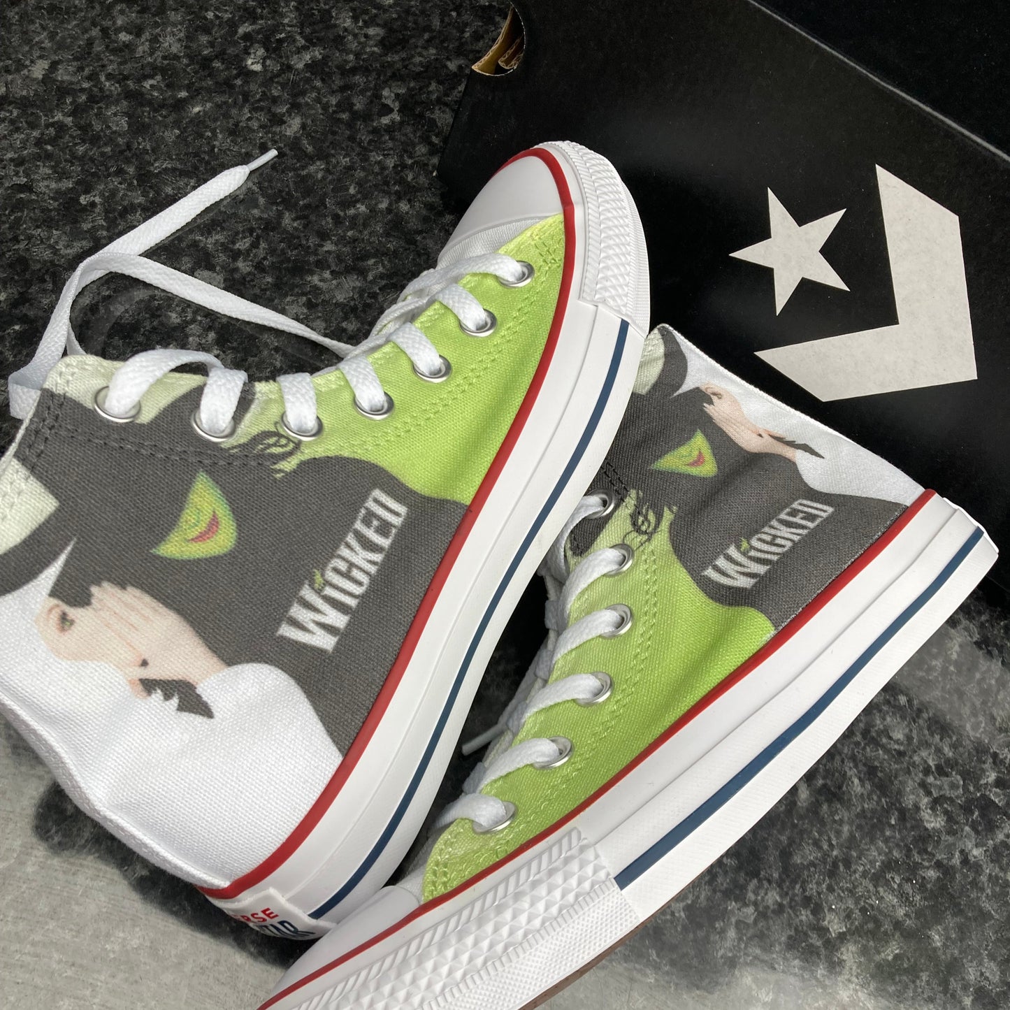 wicked custom converse design with image of Elphaba Thropp and Glinda with green and white background and the writing 'wicked'